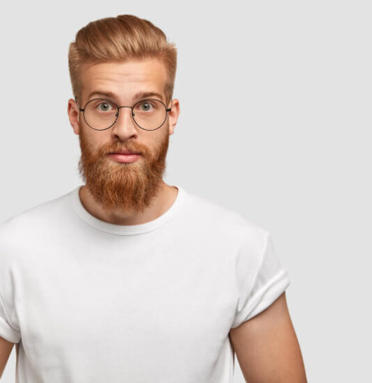 confident-ginger-man-with-trendy-hairstyle-wears-spectacles-looks-directly 1-1 confident-ginger-man-with-trendy-hairstyle-wears-spectacles-looks-directly 1-1